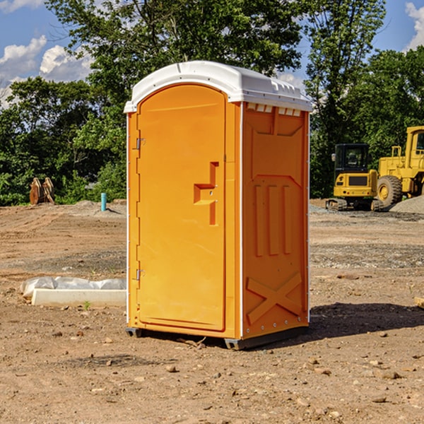 what is the cost difference between standard and deluxe portable restroom rentals in Cole County